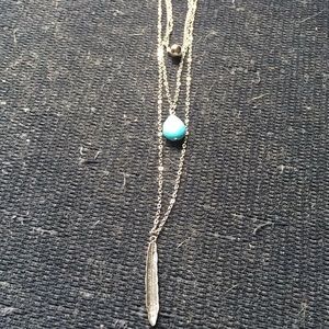 Chloe silver necklace with feather and blue stone